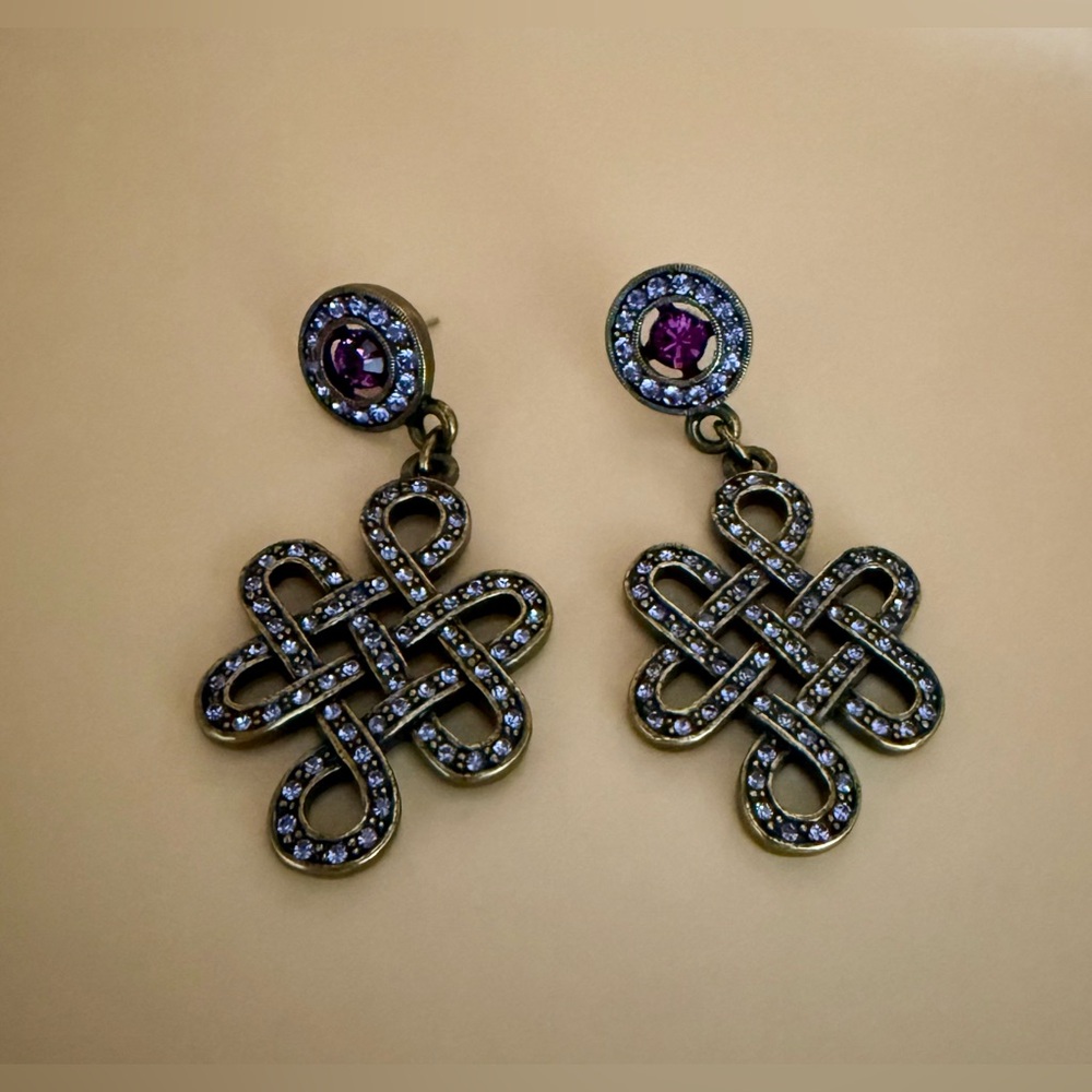 Dangling HeidiDaus Pierced Earrings.Pink & purple crystals add flare any outfit.
